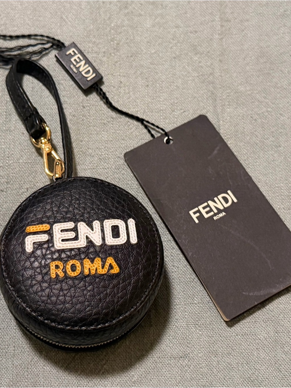 Fendi Black Pebbled Leather Round Zip bag charm with hidden Backpack